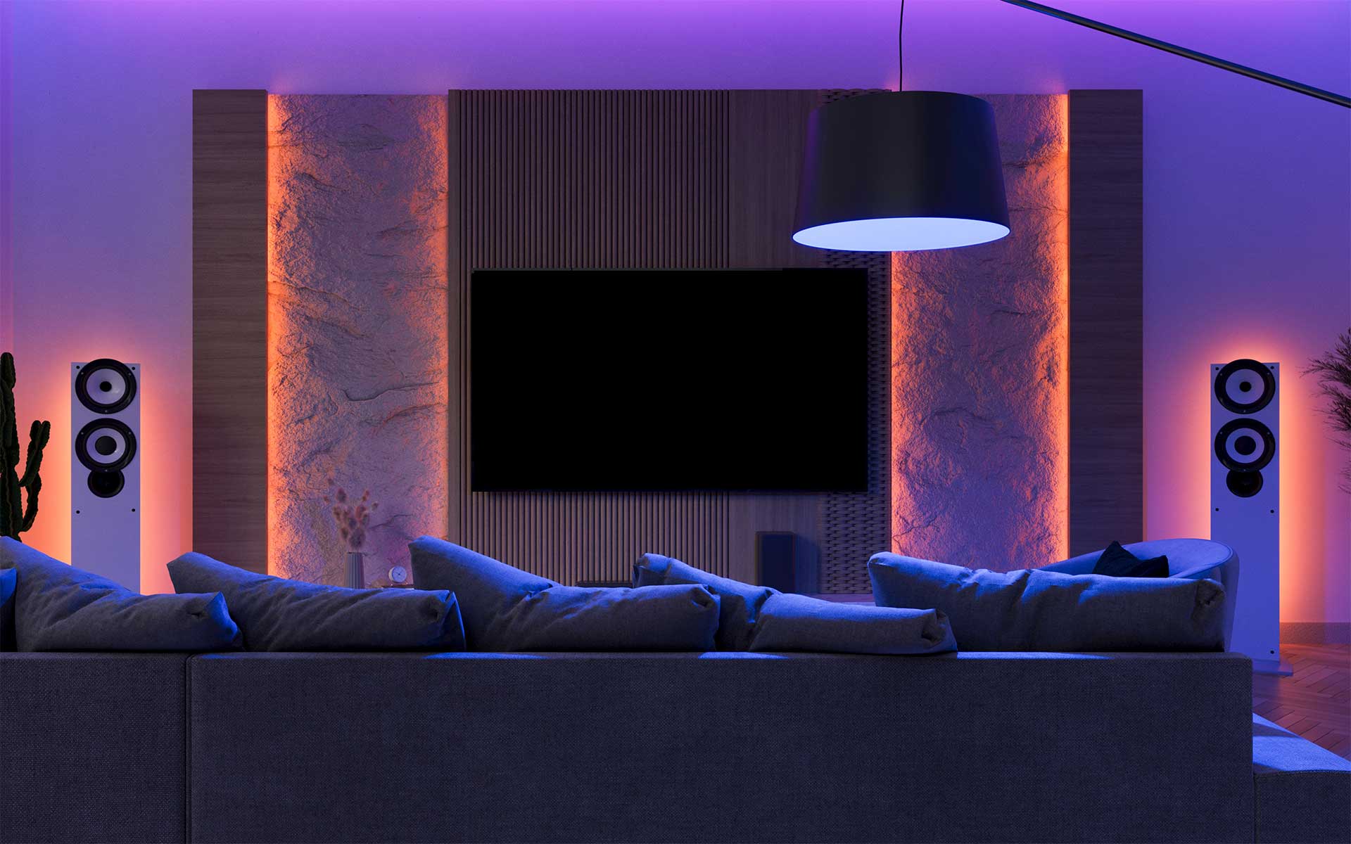Dimmed colored lights in the living room create a mood with smart home lighting control