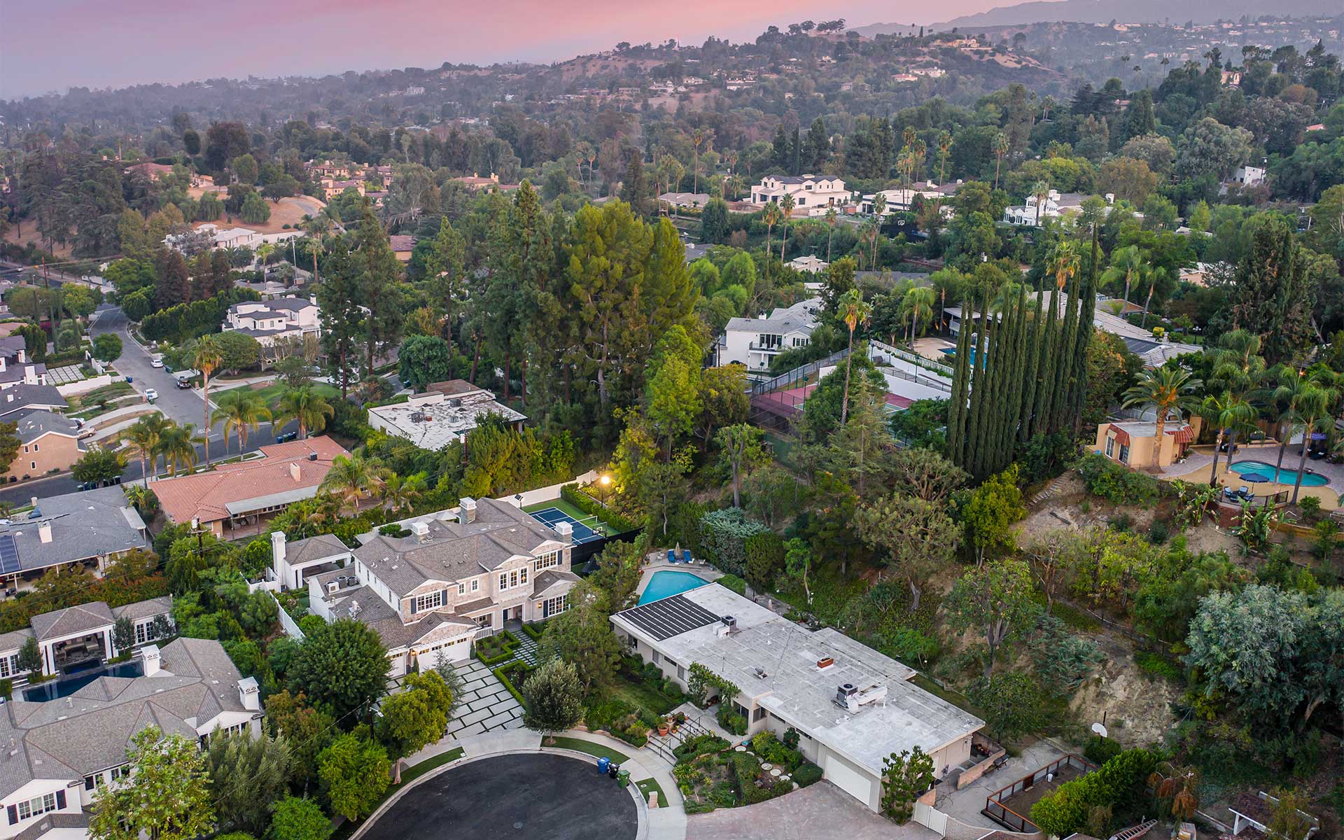 An aerial view of an Encino, CA neighborhood featuring modern estates