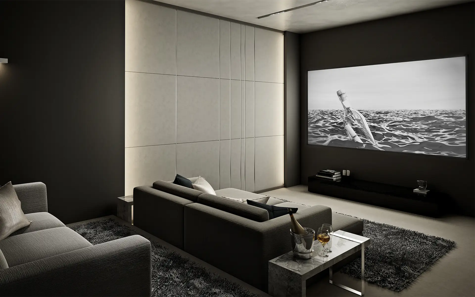 A luxury home theater room done in greys with multi-level seating and a modern, fabric-covered speaker wall